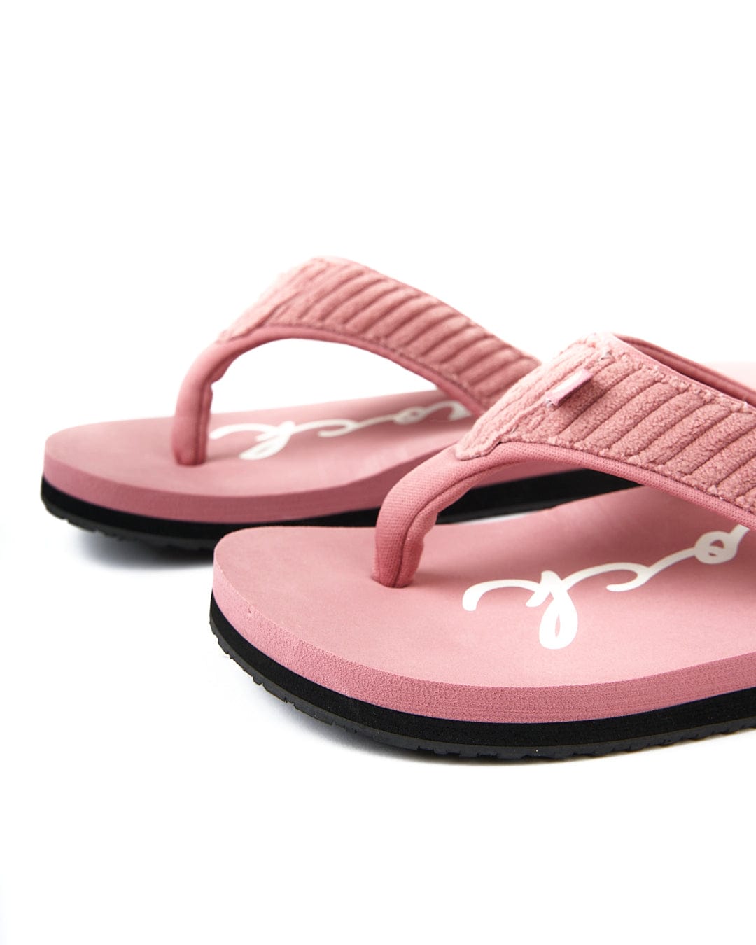 A pair of Saltrock Laguna - Womens Cord Flip Flops - Mid Pink on a white background.