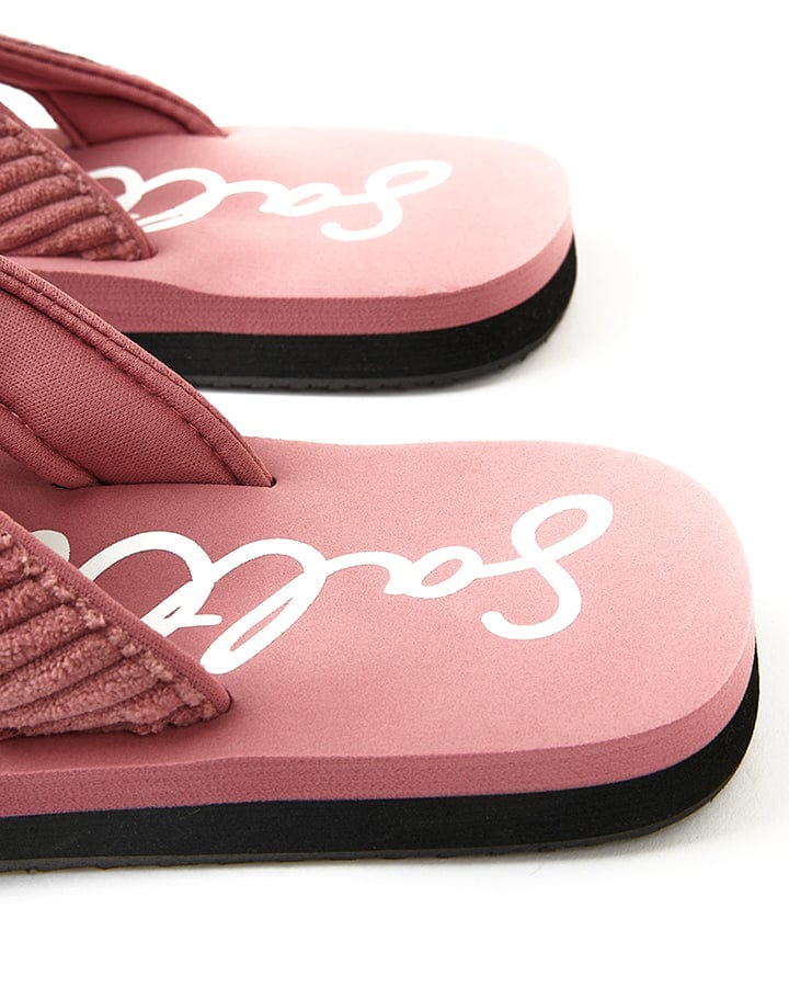 A pair of pink Saltrock Laguna - Womens Cord Flip Flops - Mid Pink with the word sarah on them.