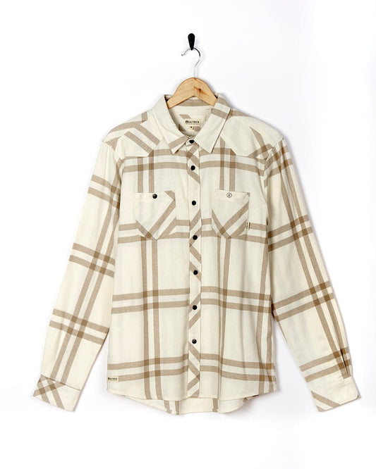A white and tan Lazer - Mens Long Sleeve Check Shirt, perfect for Saltrock shirt fans or those looking for stylish SEO keywords like check shirts or Saltrock shirts, hanging on a hanger.