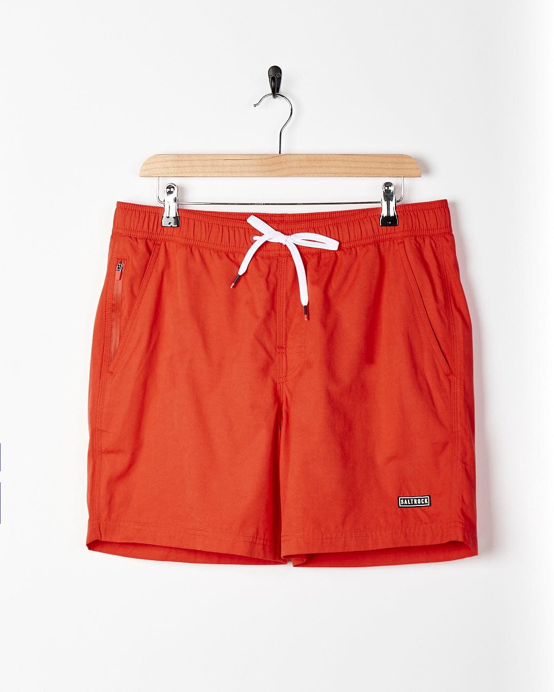 A Saltrock - Lee Mens Sueded Volley Swimshort - Red hanging on a hanger.