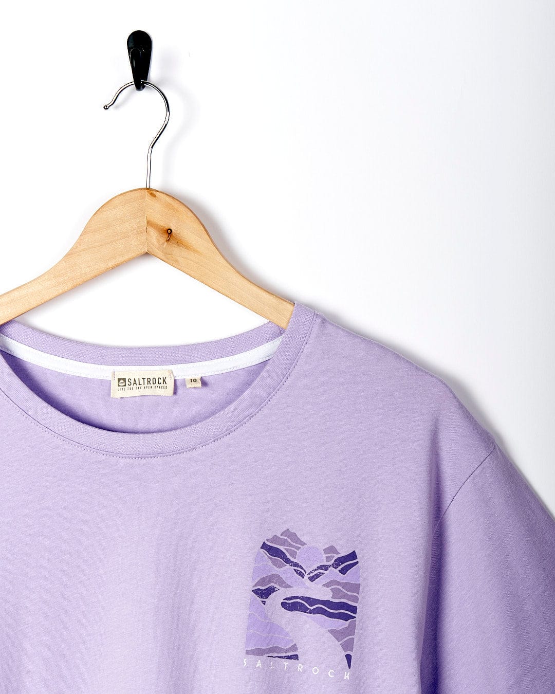 A Saltrock Live Wild - Womens Short Sleeve T-Shirt - Light Purple hanging on a hanger.