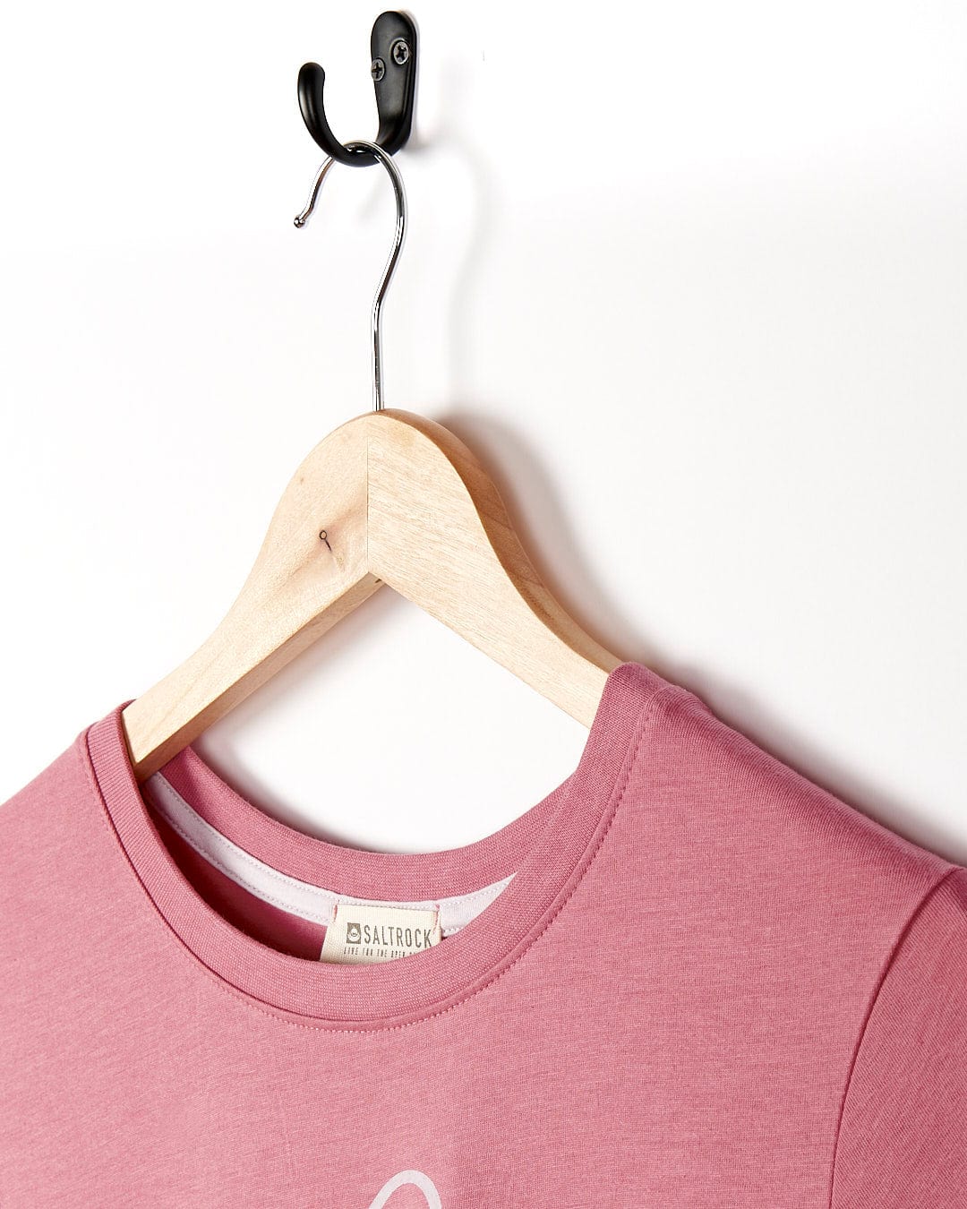 A Love Your Ocean - Womens Short Sleeve T-Shirt - Mid Pink Saltrock hanging on a hanger.