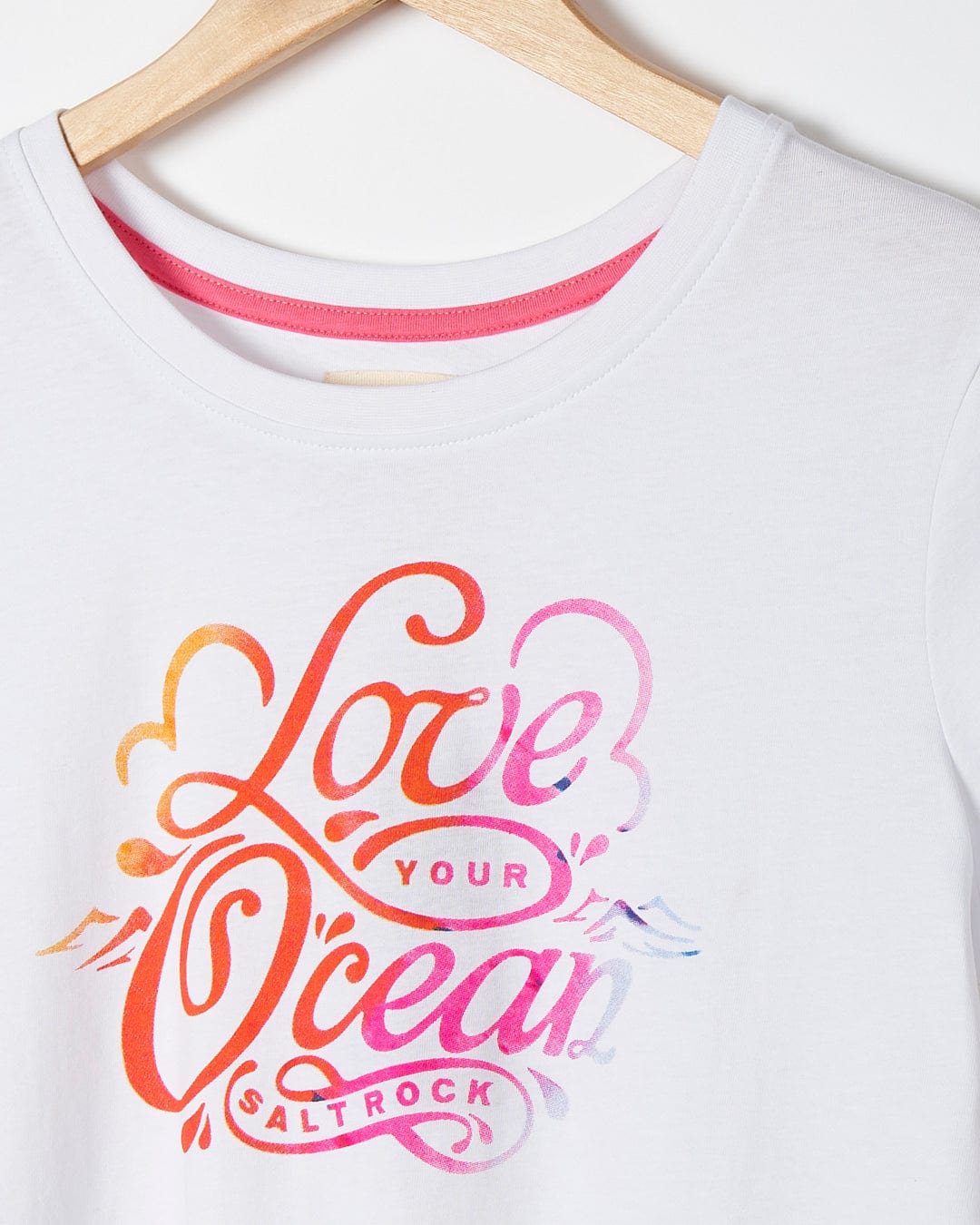 A white Saltrock t-shirt that says Love Your Ocean.