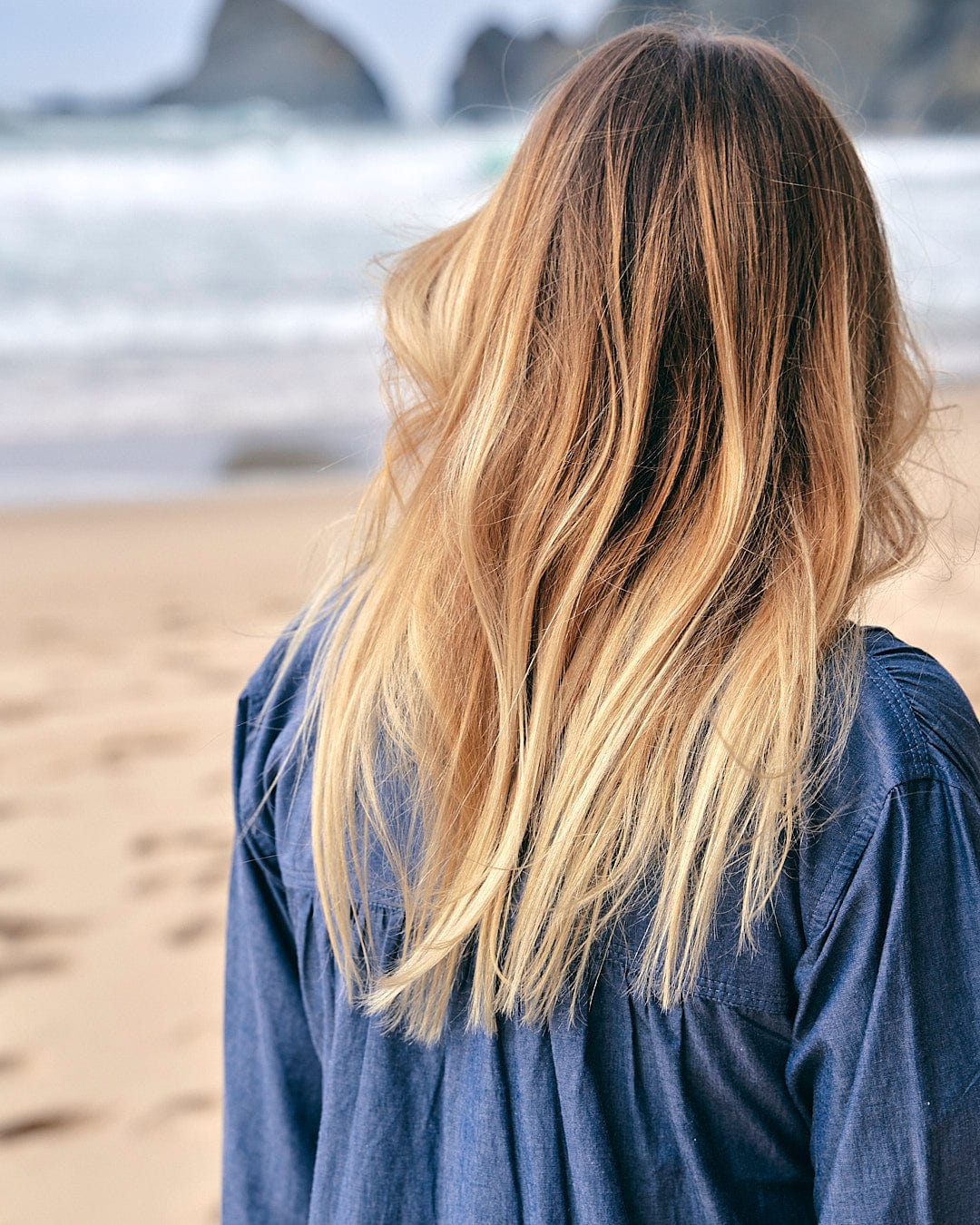 The Saltrock - Manina Womens Beach Shirt - Blue of a woman's hair on the beach.