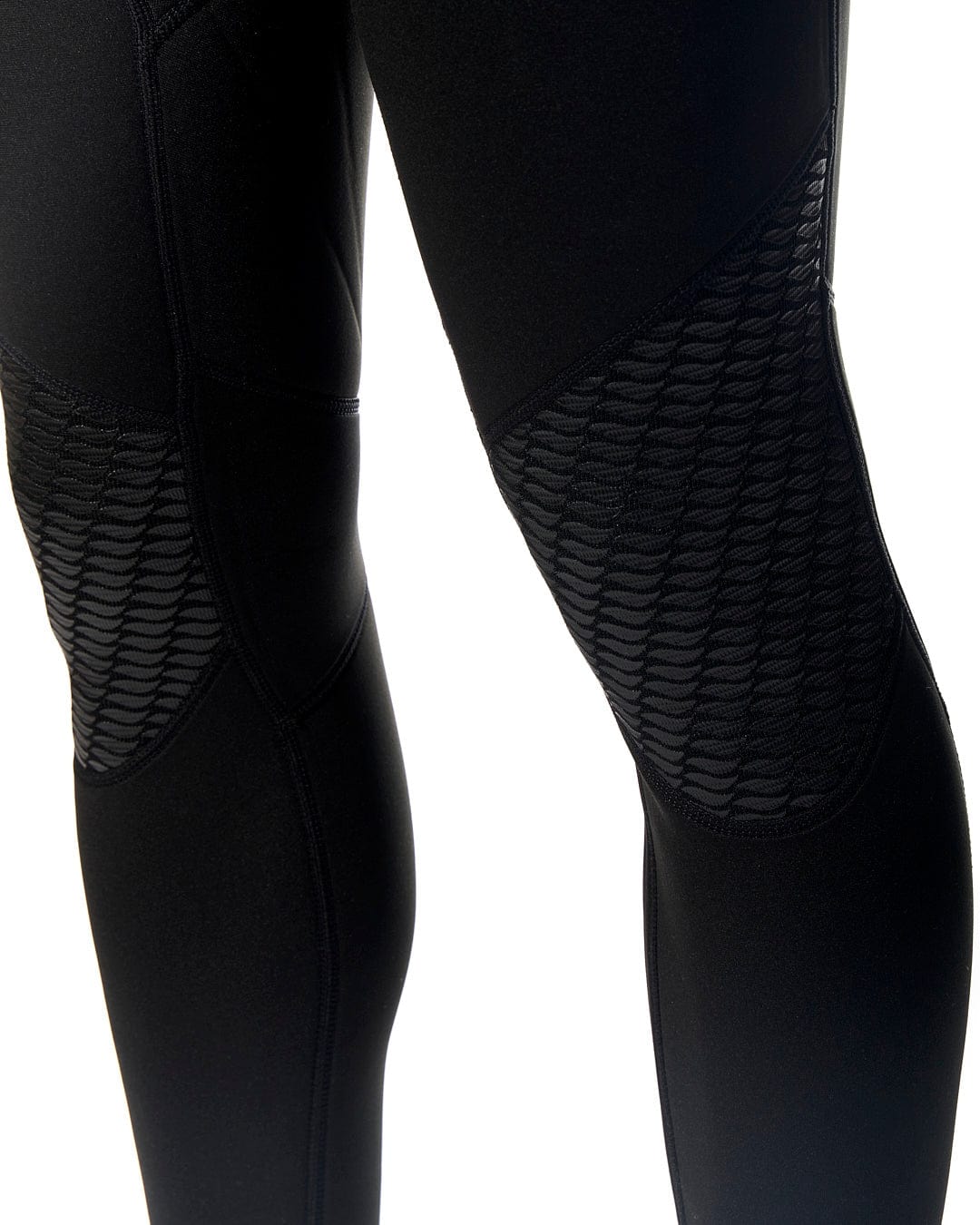 The legs of a man wearing Saltrock Core - Mens 3/2 Full Wetsuit - Blue/Black pants.