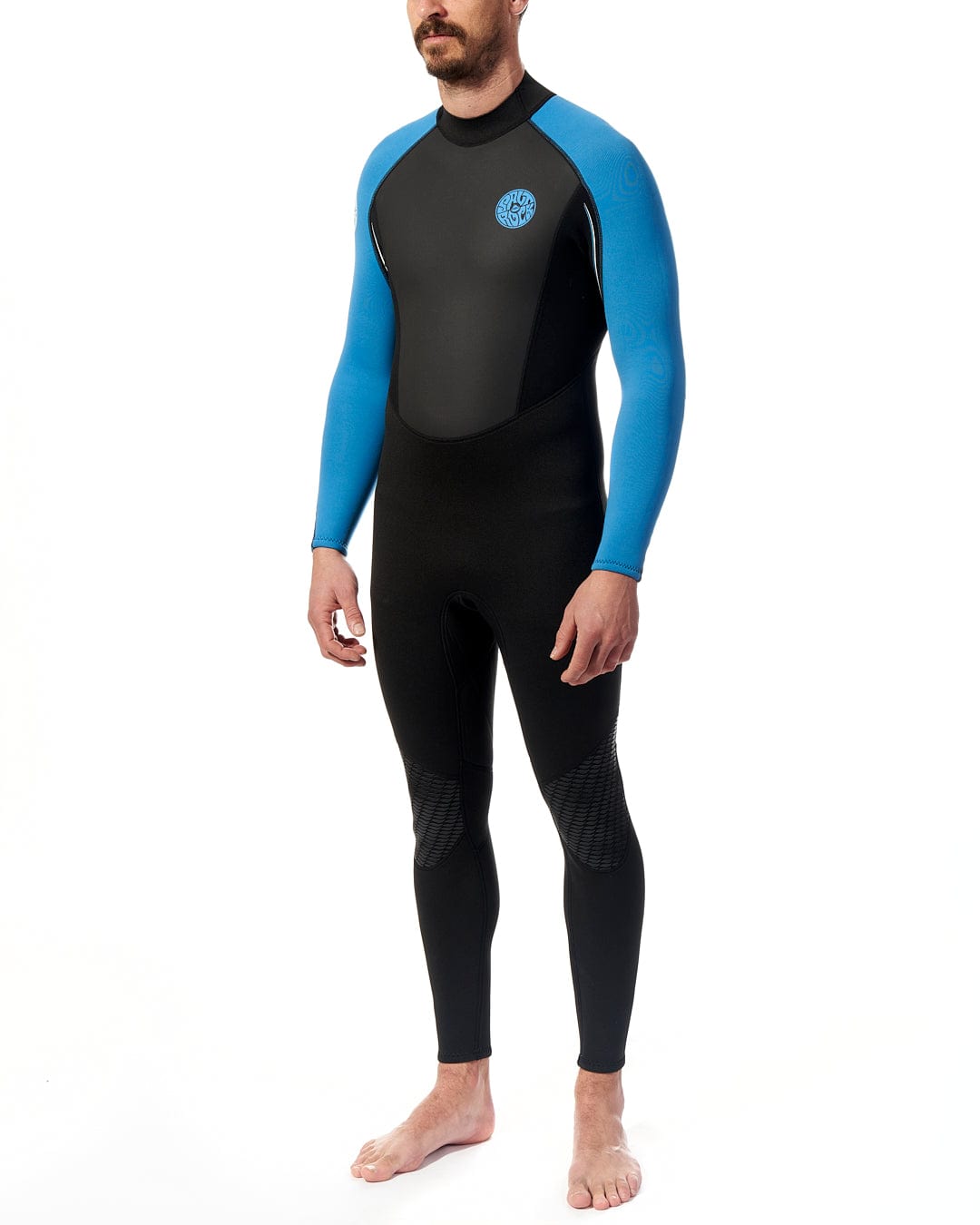 A man in a Saltrock Core - Mens 3/2 Full Wetsuit - Blue/Black standing on a white background.