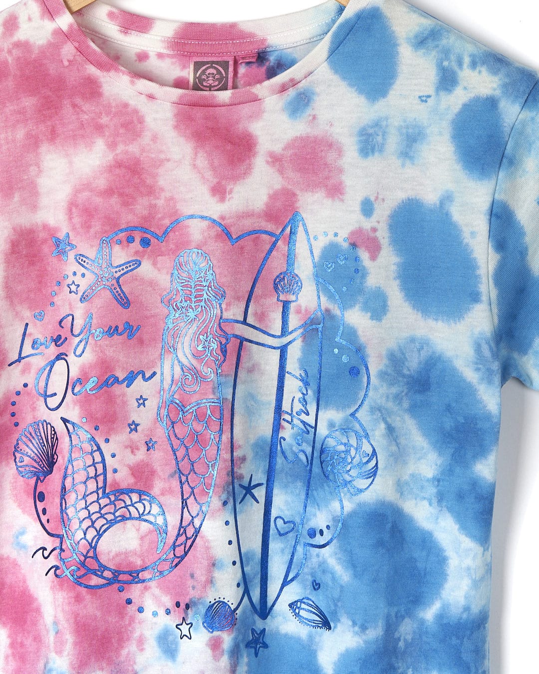 Get beach ready with this Saltrock Mermaid Surf - Kids Tie Dye Short Sleeve T-Shirt - Blue/Pink.