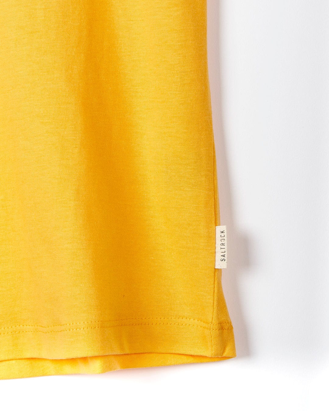 A Saltrock On The Road Cornwall - Womens Short Sleeve T-Shirt - Yellow hanging on a white wall.