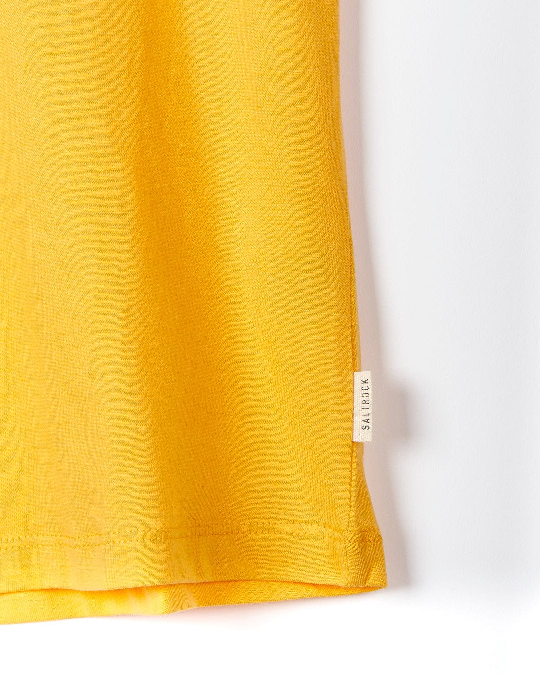 A Saltrock On The Road Cornwall - Womens Short Sleeve T-Shirt - Yellow hanging on a white wall.