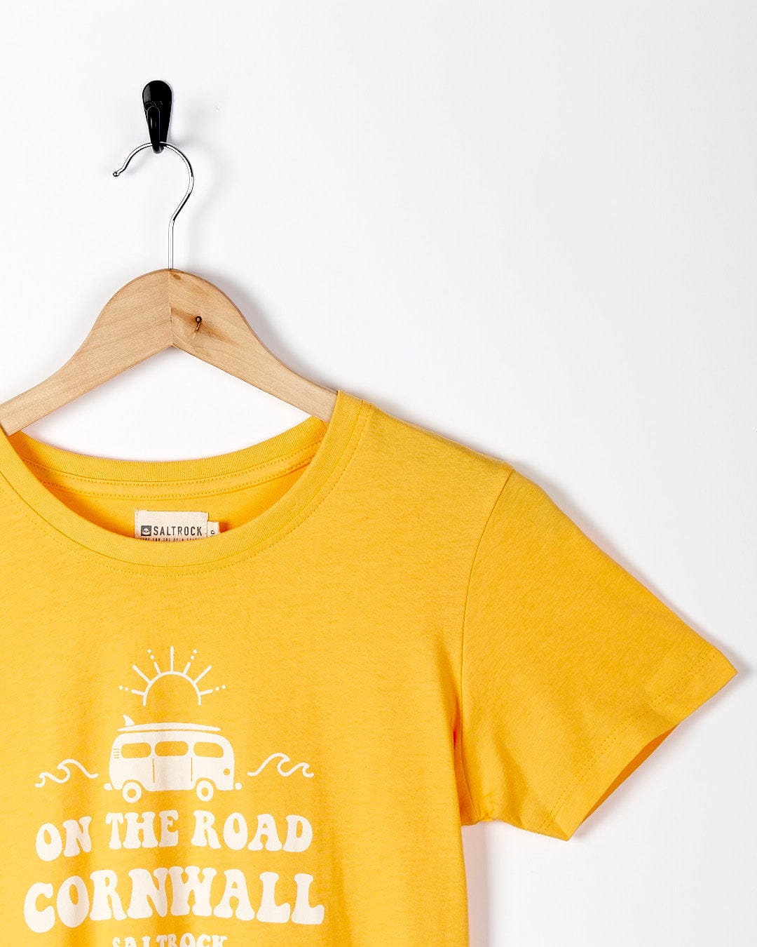 A yellow Saltrock t - shirt that says On The Road Cornwall.