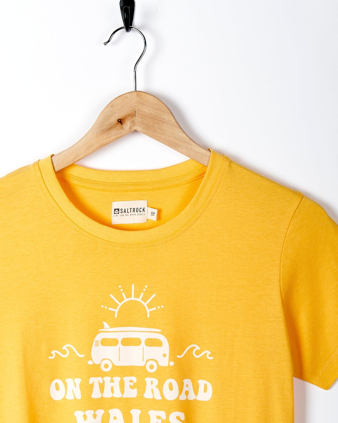 A yellow Saltrock t-shirt that says On The Road Wales.