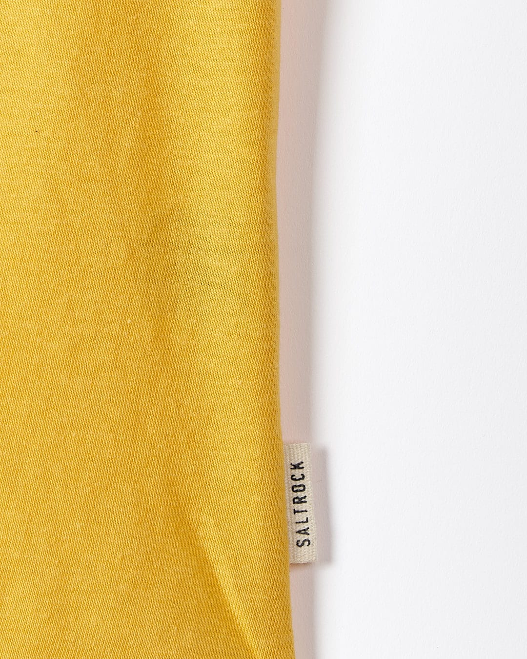 A Saltrock yellow t-shirt with the On The Road Wales - Womens Short Sleeve T-Shirt - Yellow label on it.