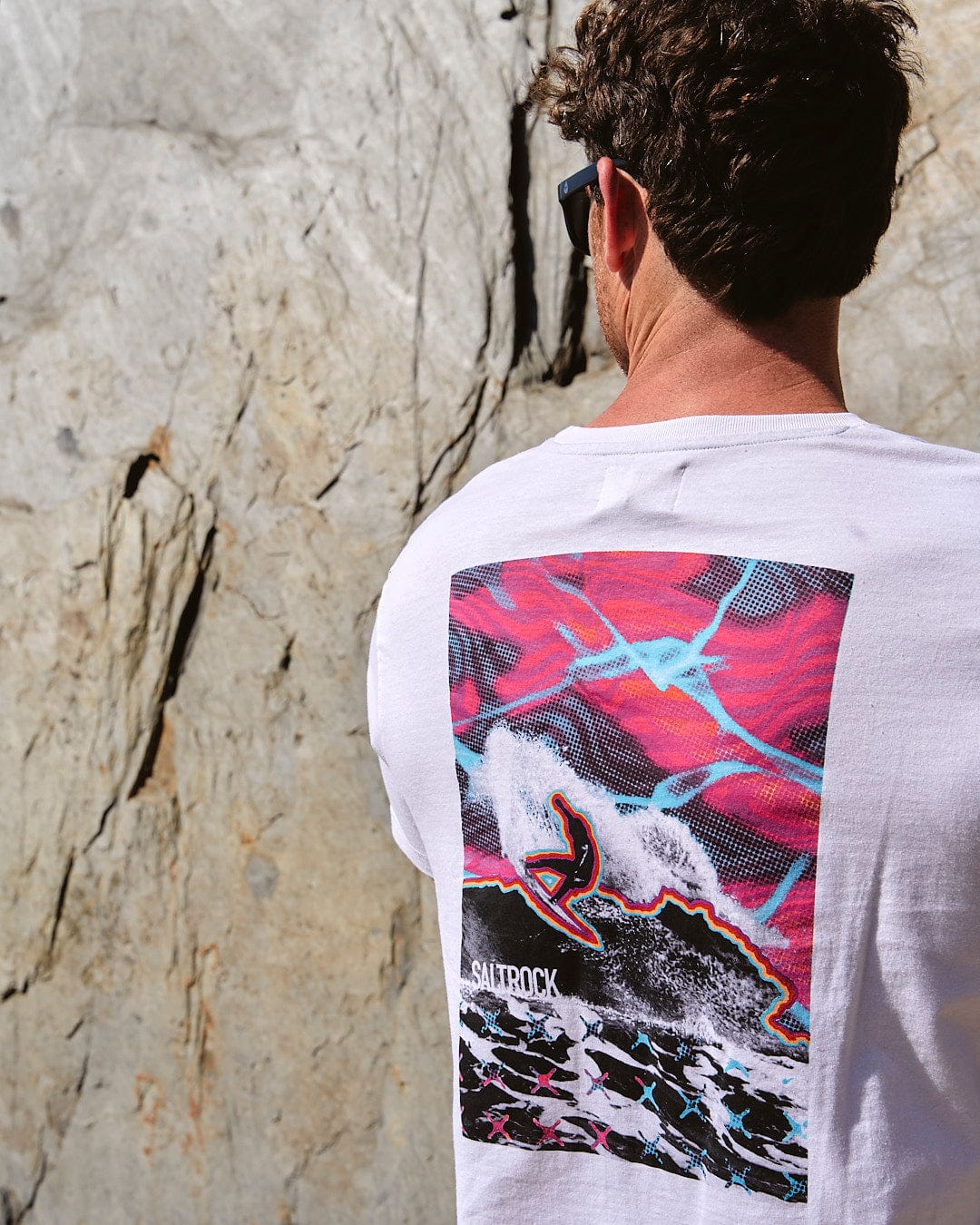 The back of a man wearing a Saltrock Poolside Wave - Mens Short Sleeve T-Shirt - White.