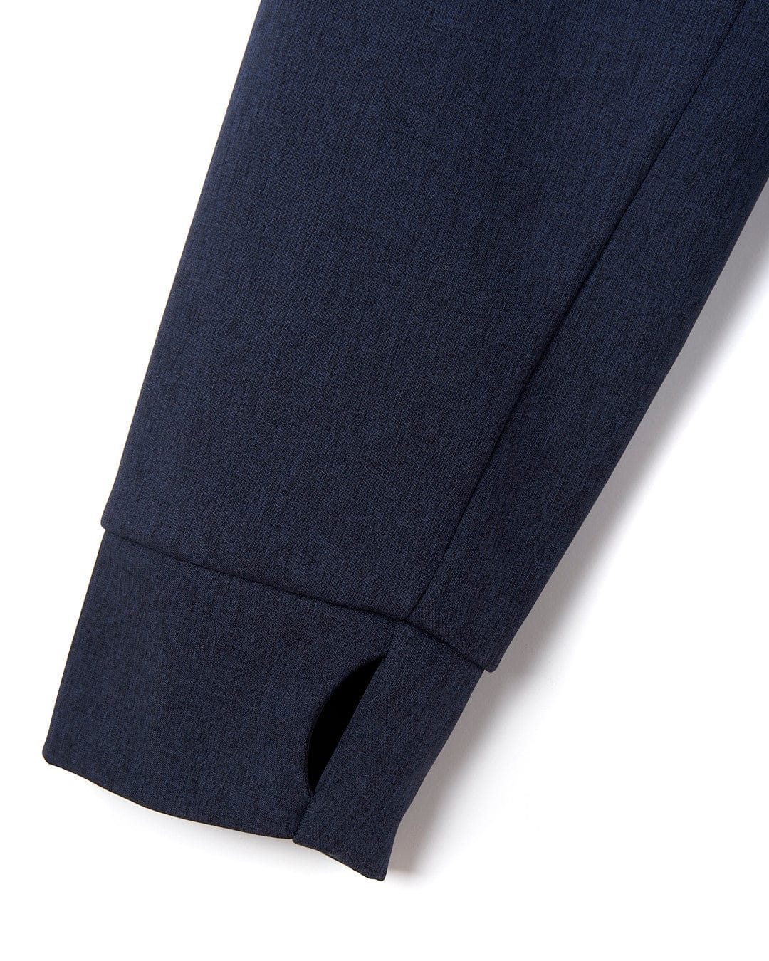 A close up of Saltrock's Purbeck Padded Jacket - Dark Blue slacks.