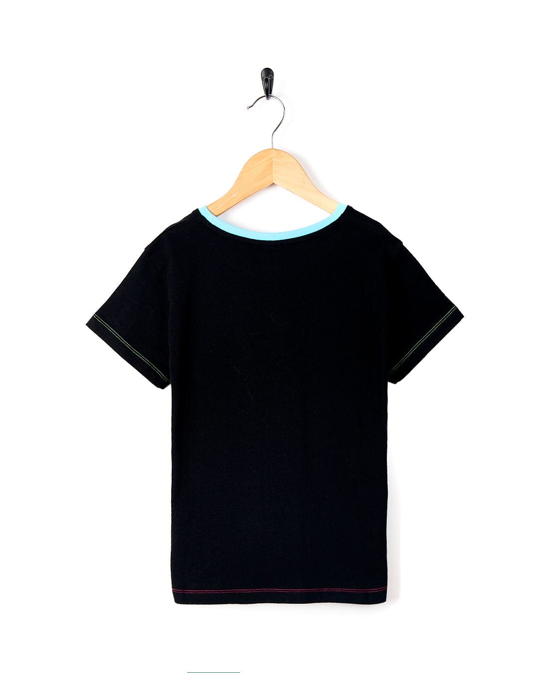 A Rayssa - Kids Short Sleeve Pocket T-Shirt - Black shirt on a Saltrock swinger.