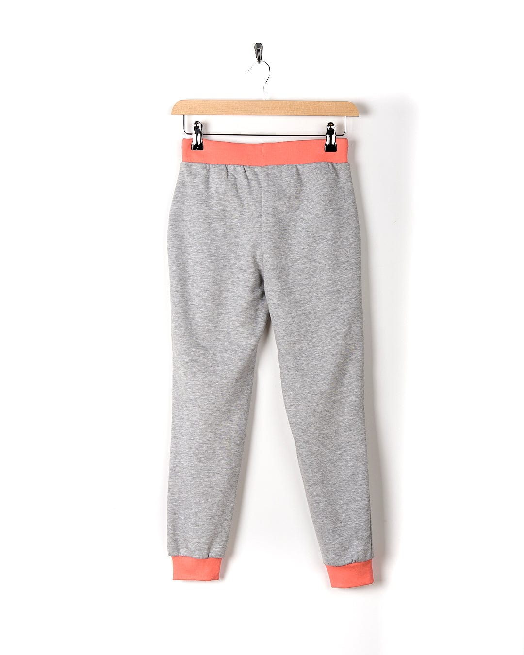 A Road Panel - Kids Jogger - Grey sweatpants from Saltrock hanging on a hanger.