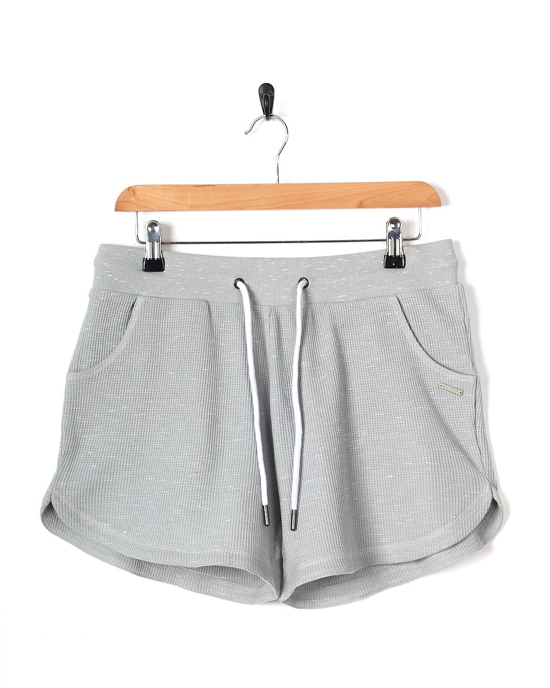 A Saltrock Rosalin - Womens Sweat Short - Light Grey hanging on a hanger.