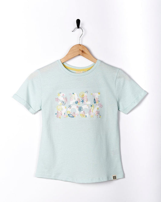 A Saltrock Seabed - Kids Short Sleeve T-Shirt - Light Blue with flowers on it.