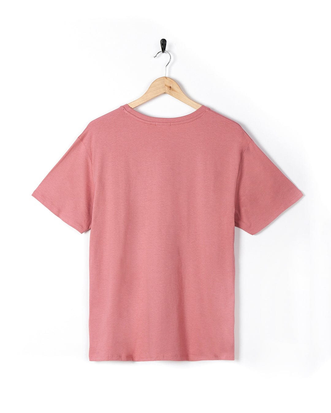 A Sea Shells - Womens Relaxed Fit T-Shirt - Mid Pink by Saltrock hanging on a wooden hanger.
