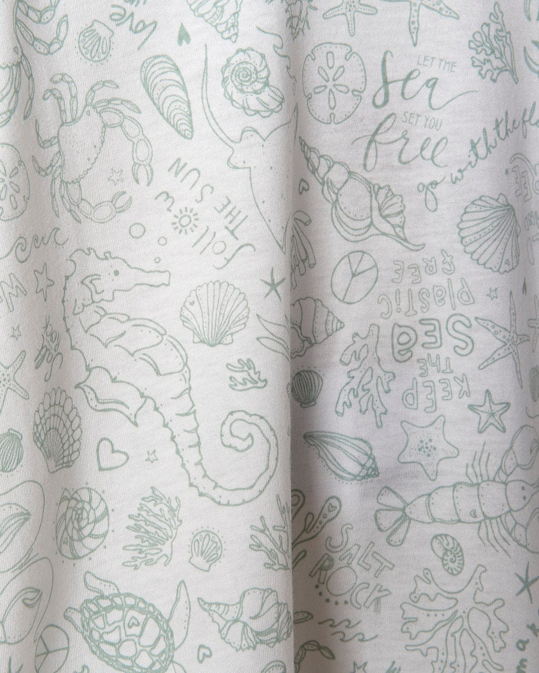 A close up of a Seashore - Saltrock Kids All Over Print Short Sleeve T-Shirt - White fabric with sea creatures on it.