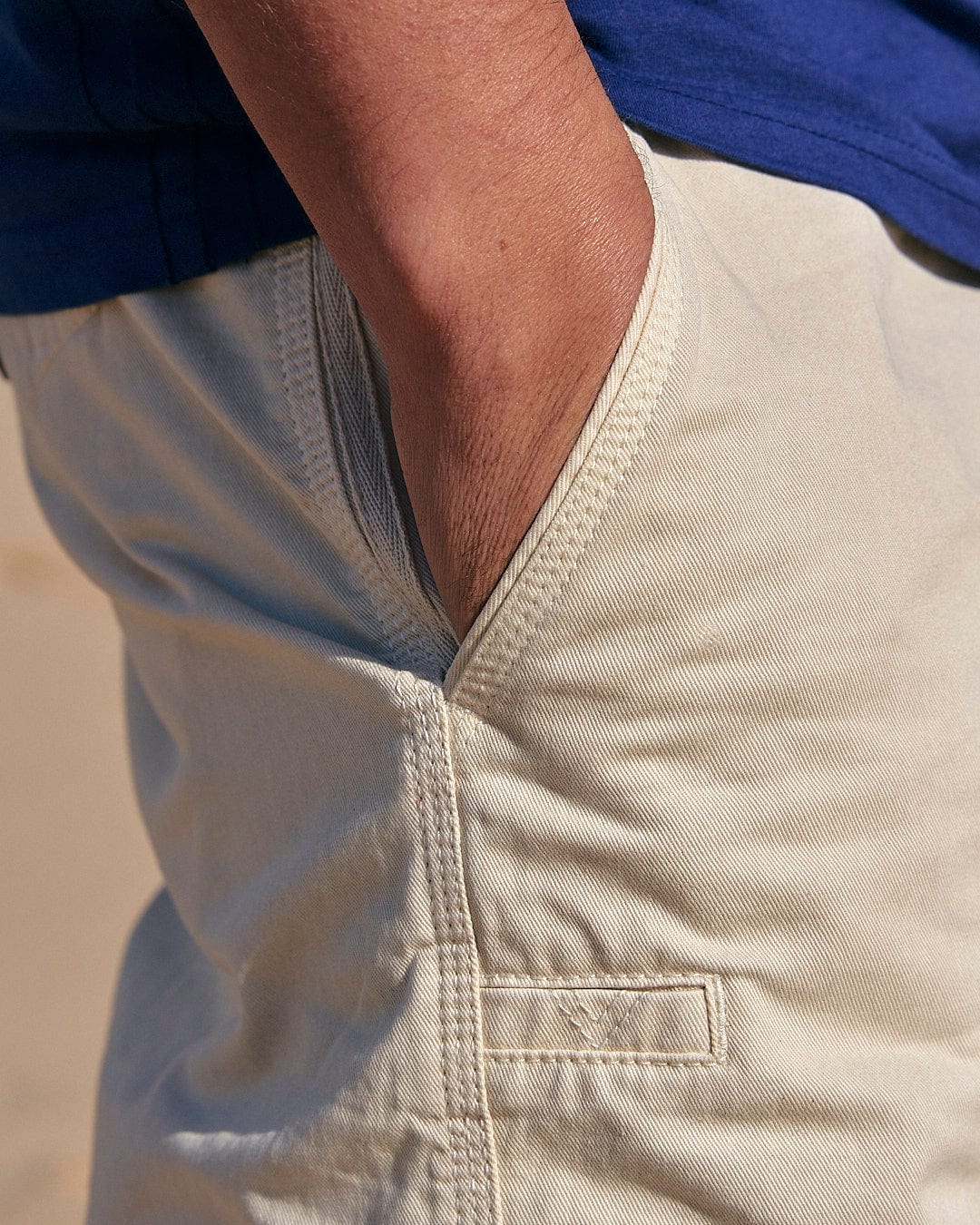 A man's pocket on a pair of Saltrock Sennen - Mens Chino Short - Natural shorts.