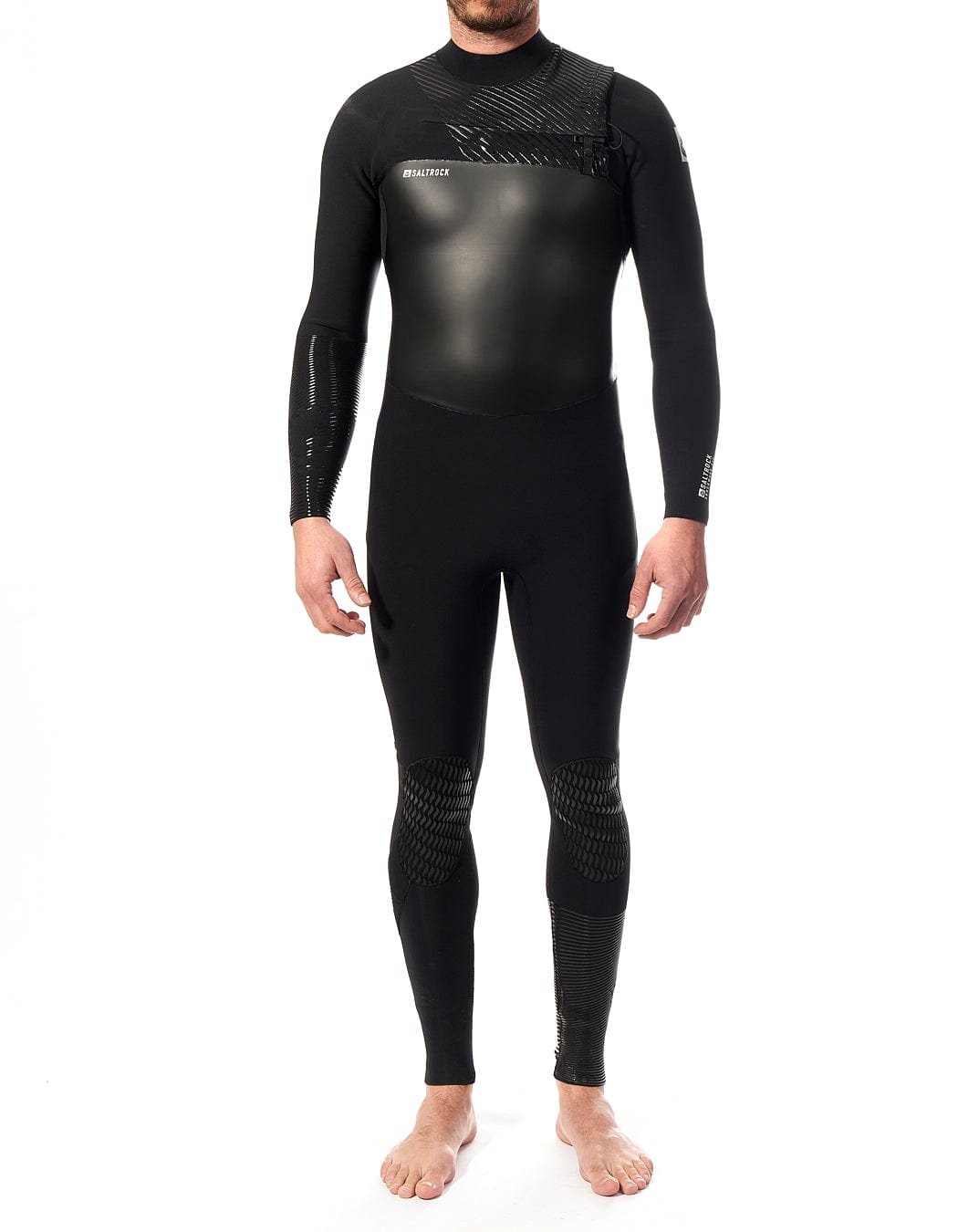 A man in a Saltrock Shockwave - Mens 3/2 Chest Zip Full Wetsuit - Black standing in front of a white background.
