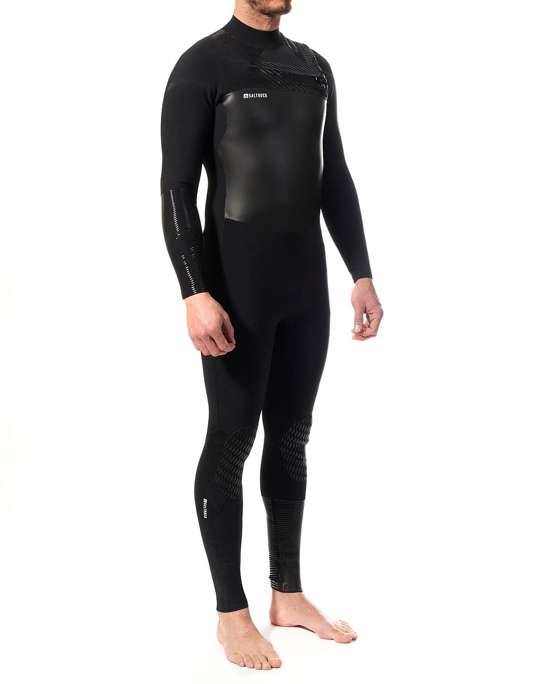 A man in a Saltrock Shockwave - Mens 3/2 Chest Zip Full Wetsuit - Black standing on a white background.