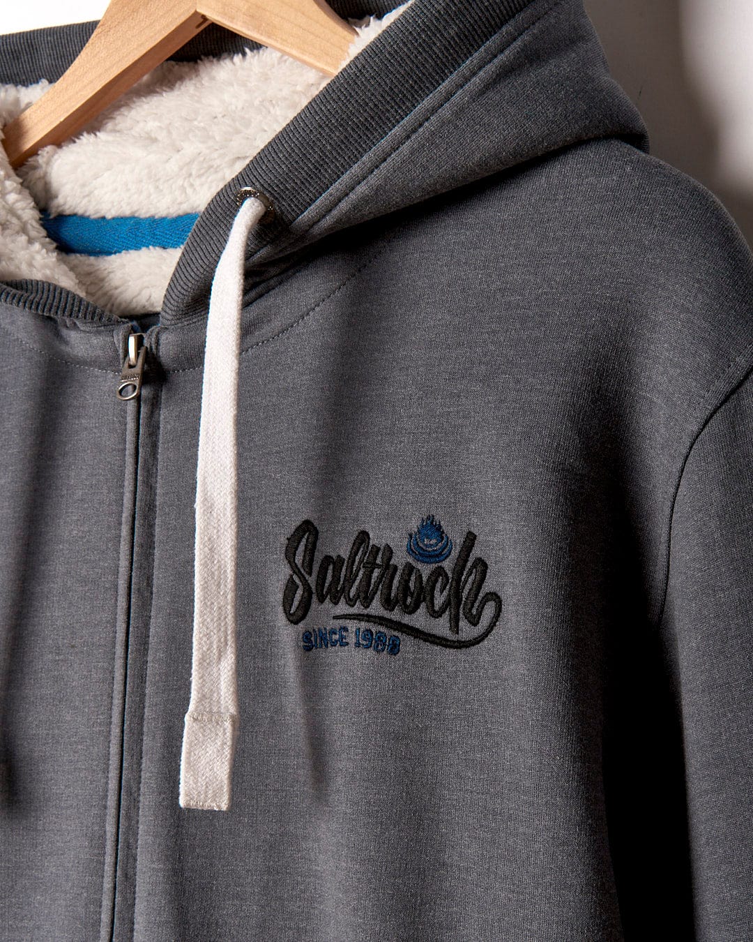 A Speed - Mens Borg Lined Hoodie in grey with a Saltrock logo on it.