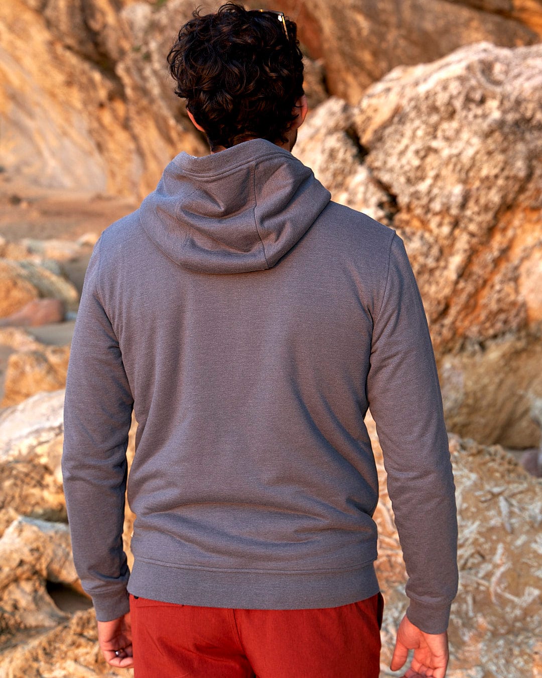 The back of a man wearing a Saltrock Speed - Mens Borg Lined Hoodie - Grey.