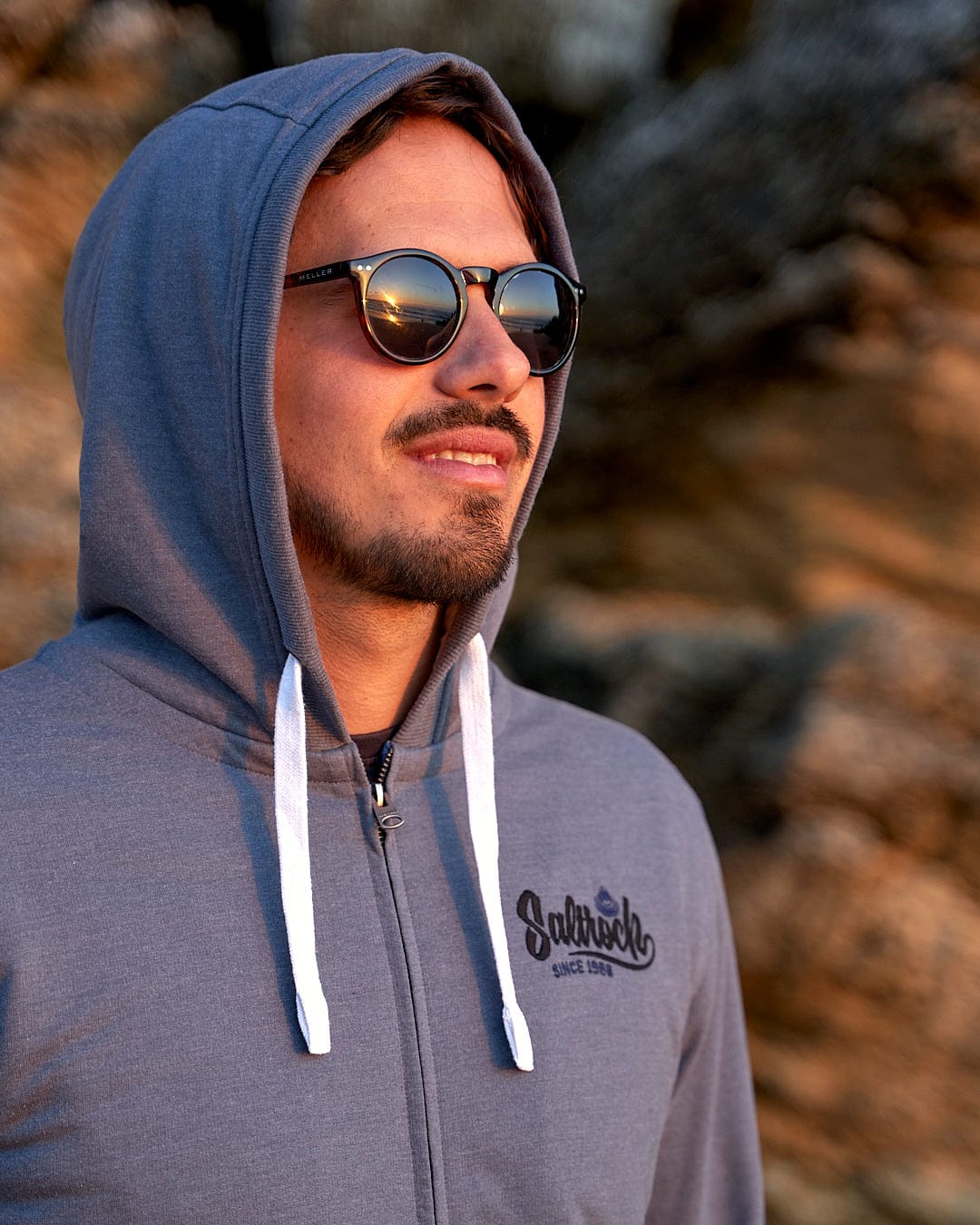 A man wearing sunglasses and a Saltrock Speed - Mens Borg Lined Hoodie - Grey.