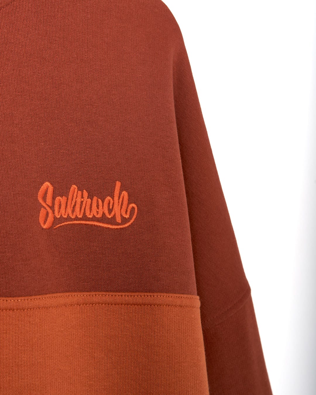 A sweatshirt with the word Speed Embroidery - Mens 1/4 Neck Zip - Red by Saltrock on it.