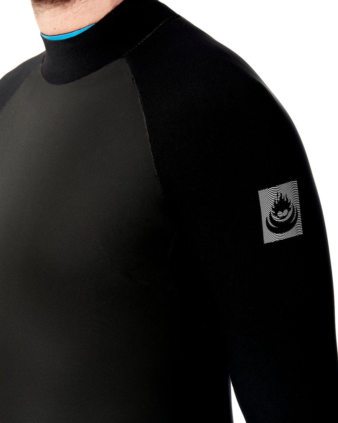 A man is wearing a Saltrock Synthesis - Mens 4/3 Back Zip Full Wetsuit - Black.