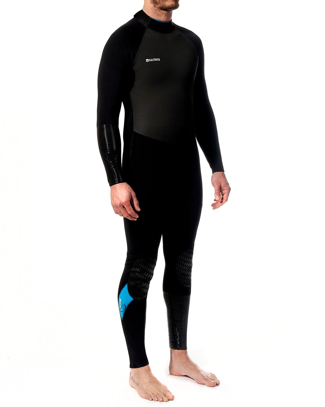 A man in a Saltrock Synthesis - Mens 4/3 Back Zip Full Wetsuit - Black standing on a white background.