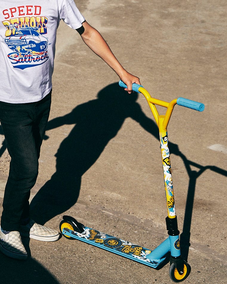 A man on a Saltrock Warped - Stunt Scooter - Blue.