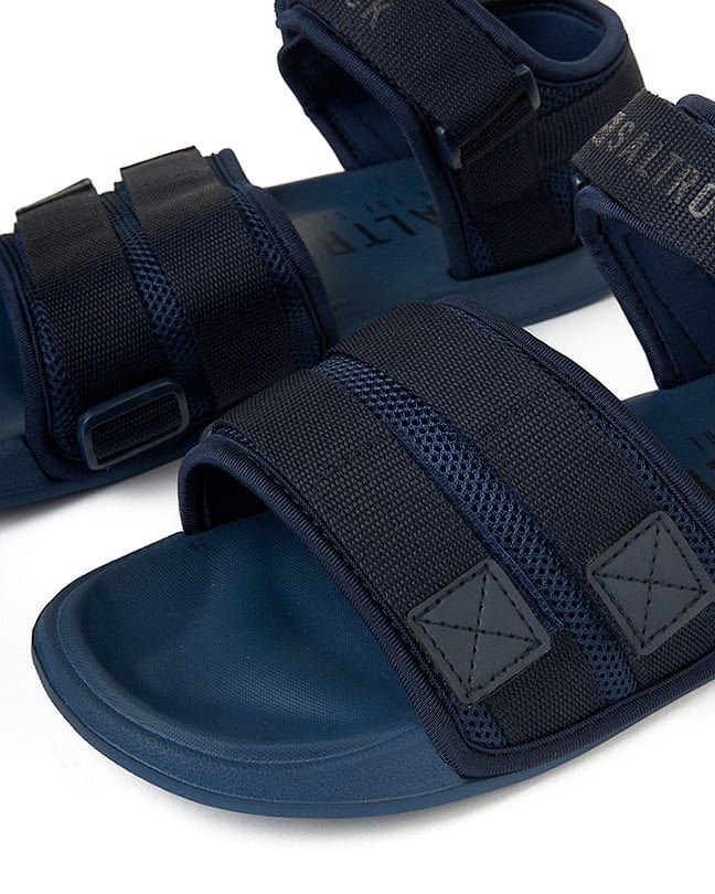 A pair of Saltrock's Take A Hike - Velcro Slider - Blue men's navy sandals on a white background.