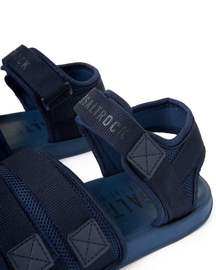 A pair of Saltrock men's navy sandals with straps, named Take A Hike - Velcro Slider - Blue.