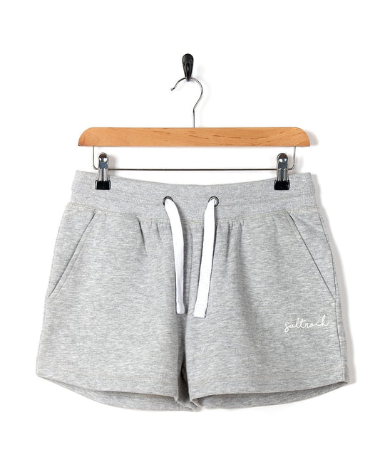 These Saltrock Velator - Womens Sweat Shorts - Light Grey feature a white logo, offering a comfortable fit.
