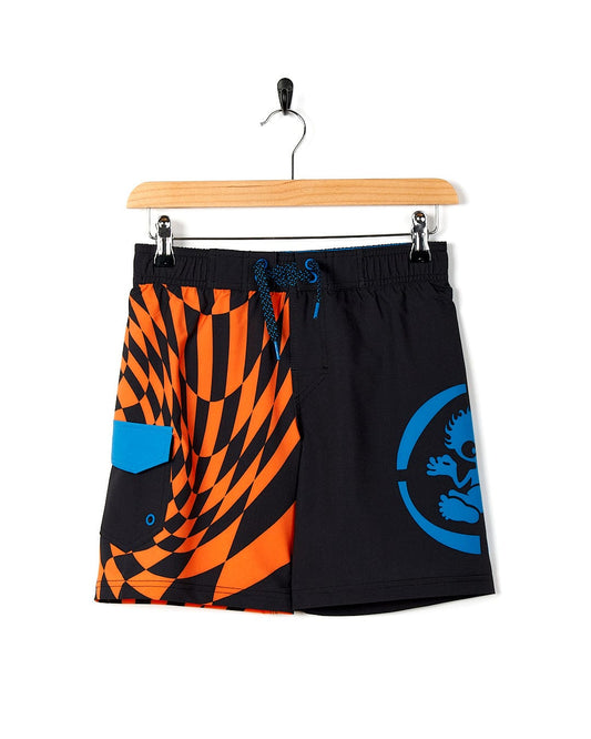 A pair of Warped Kids Boardshorts - Black from Saltrock on a swinger.